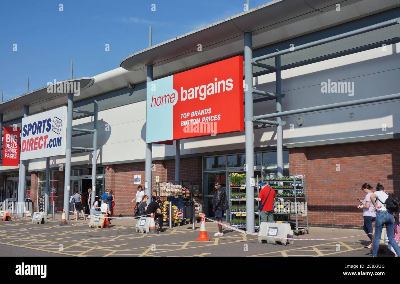 Social distancing queue at a shopping retail park on the first day of shops opening after the COVID 19 lockdown Stock Photo