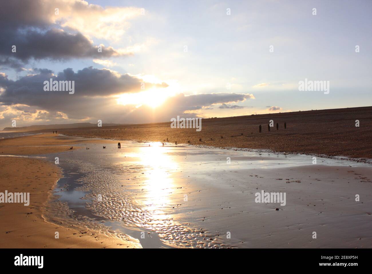 The beach at Winchelsea at sunset Stock Photo Alamy