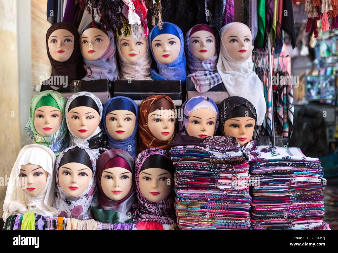 Mannequin of arab women wearing colorful fabric hijab on head in market in Morocco. Concept of travel, religion, islam, clothing, fashion, arab art, Stock Photo