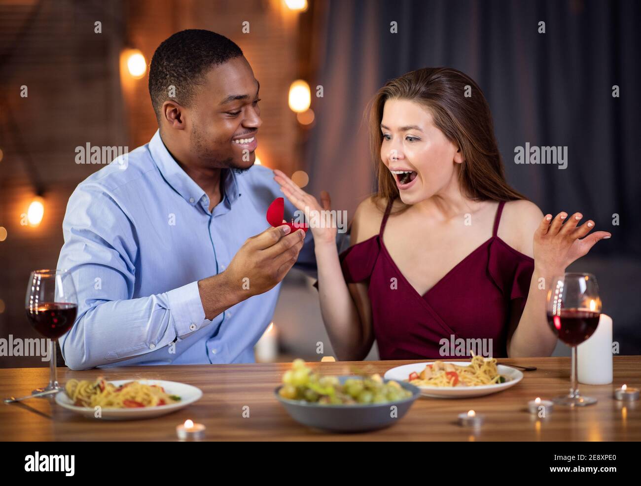 Proposal Surprise. Romantic young black man proposing marriage to his