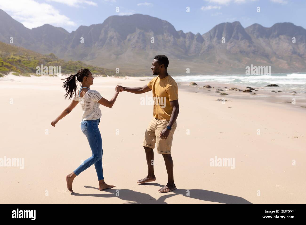 African american couple having fun dancing on a beach by the sea Stock ...