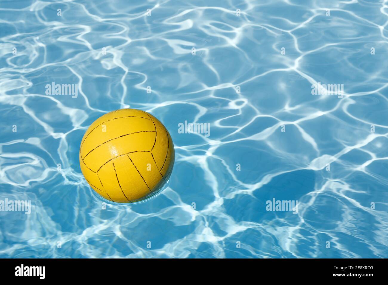 Background with yellow ball in the swimming pool and copy space Stock Photo