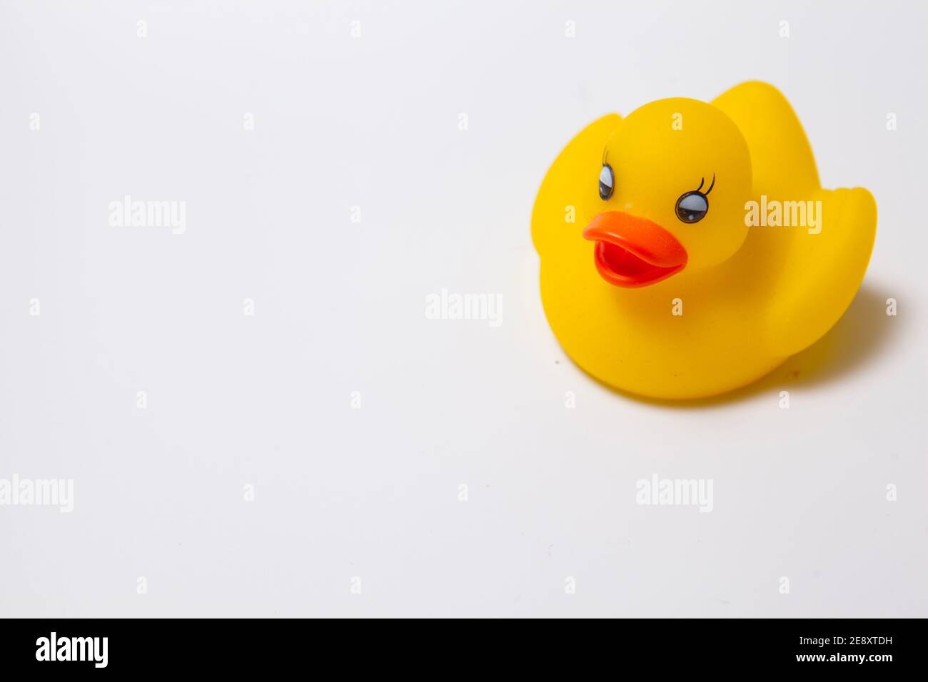 Cute yellow rubber duck isolated on white Stock Photo - Alamy