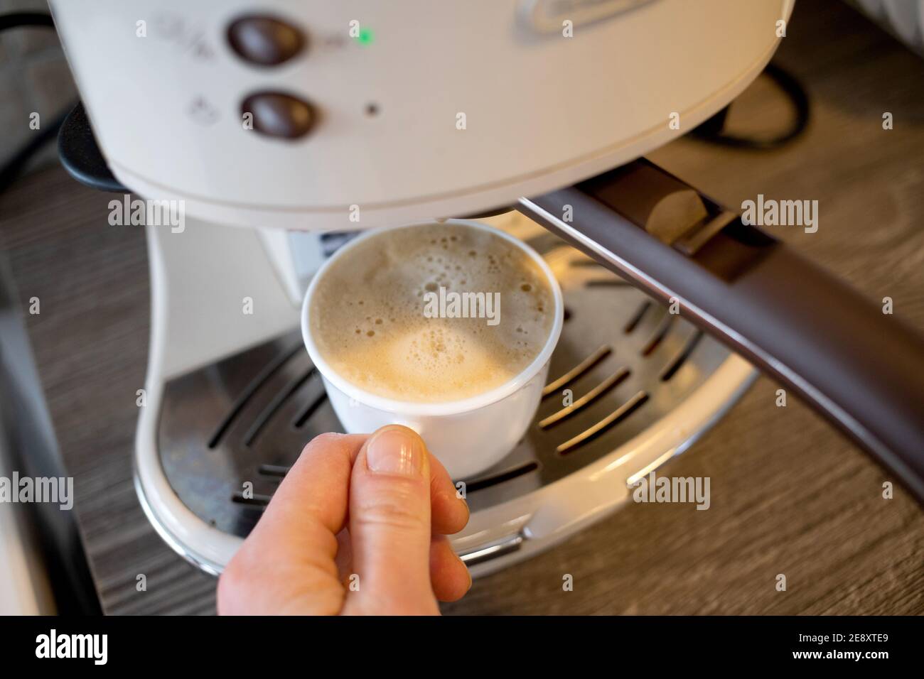 making cup of coffee in coffee maker Stock Photo Alamy