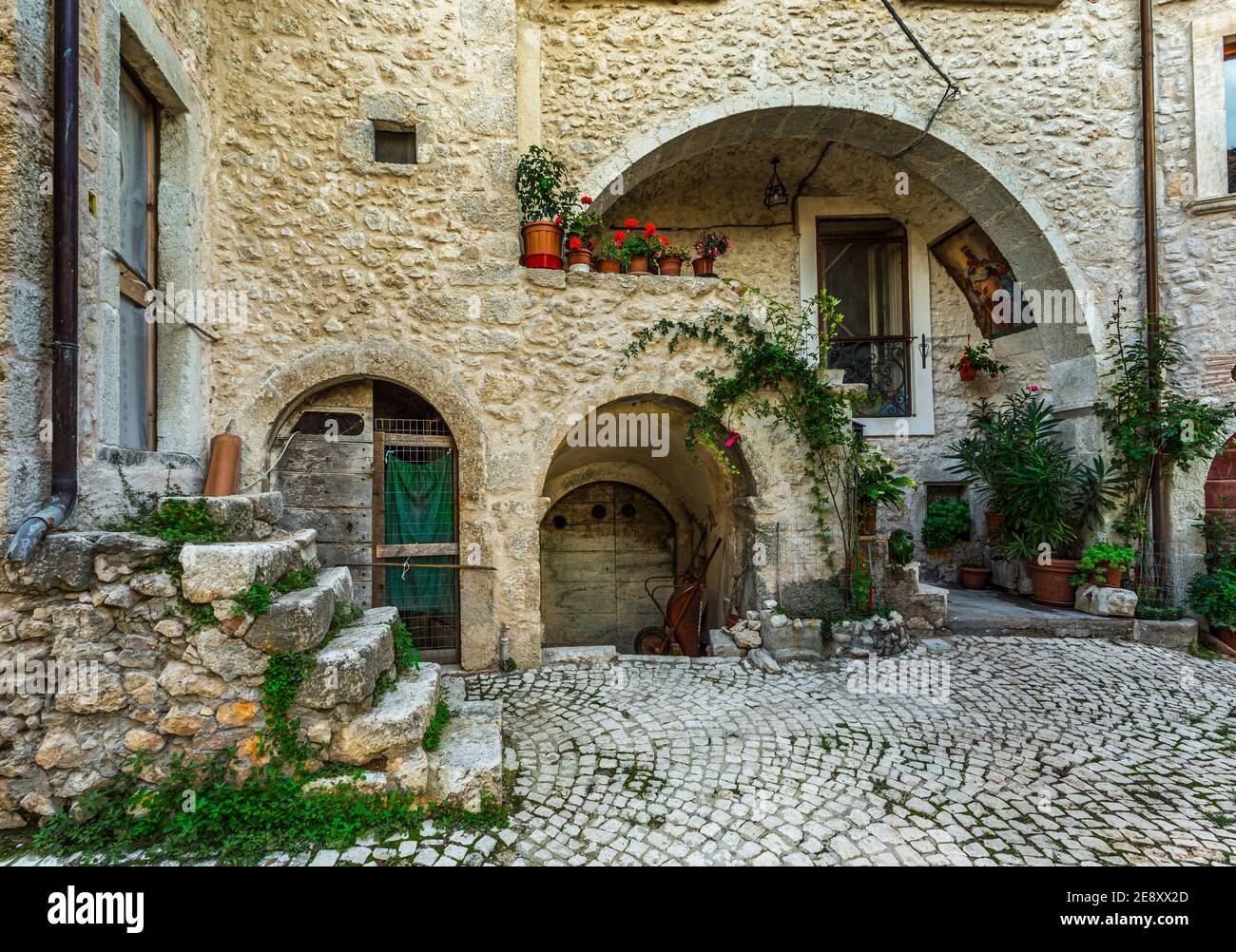 Entrances to a complex of old stone houses now restored. Stock Photo