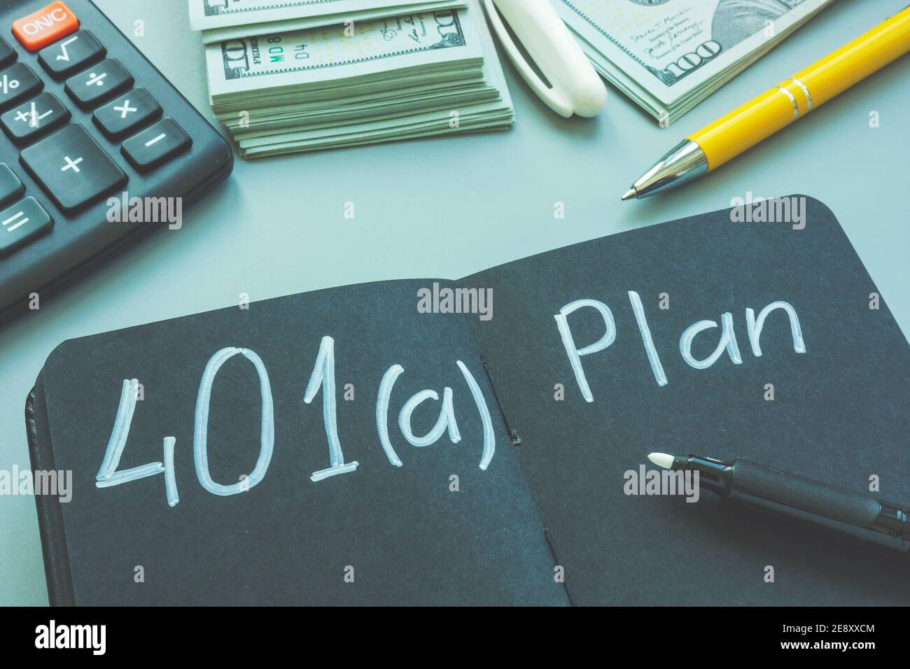 401a plan for retirement on the black pages. Stock Photo