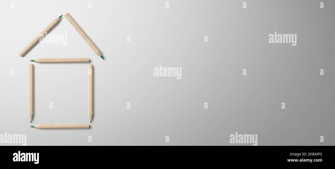 Flat lay top view of outline of house on gray background, housing concept. Copy space. Stock Photo