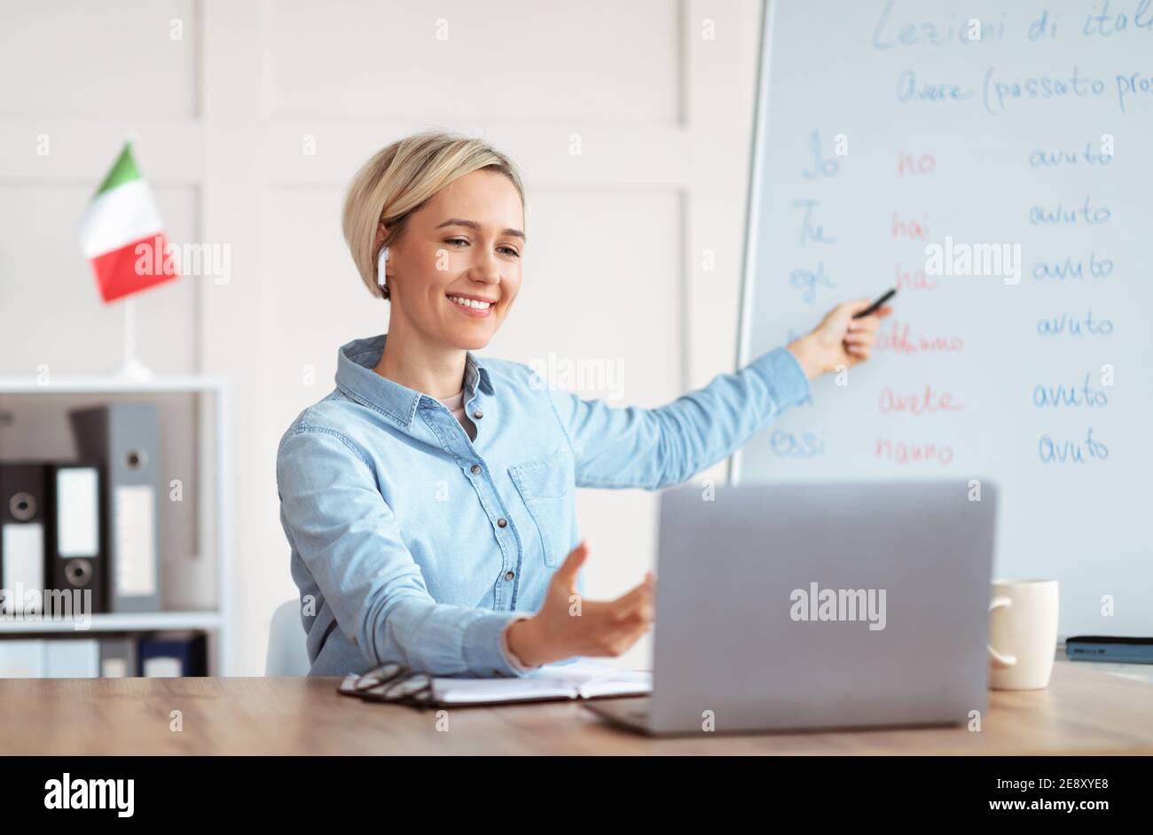 Online foreign languages tutoring. Joyful teacher giving Italian class