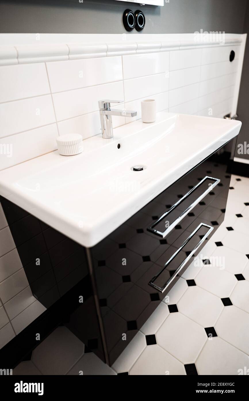a modern black and white sink in a bathroom Stock Photo Alamy