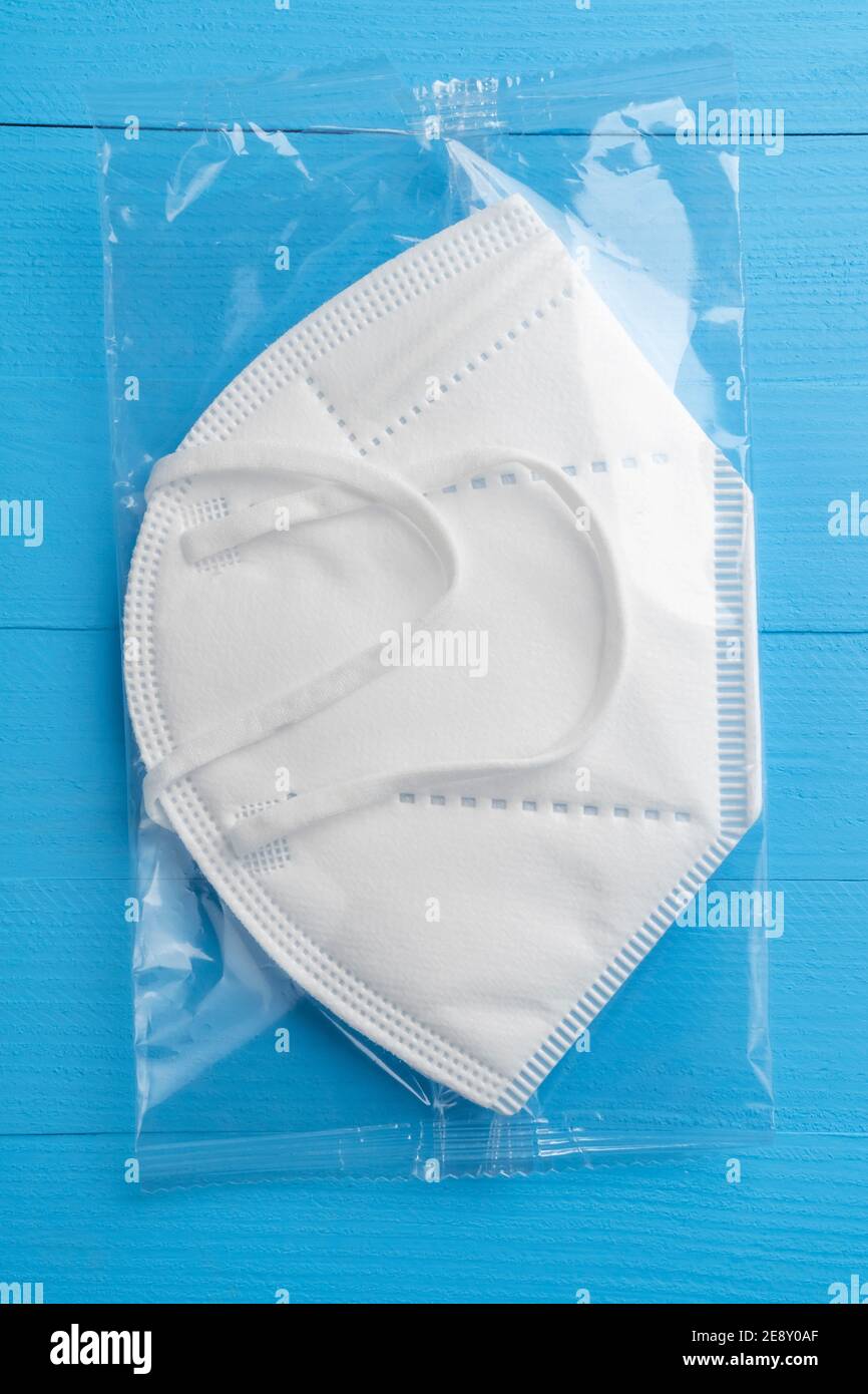 Fpp Mask KN95 FPP2 medical respirator white mask medical equipment on blue ...