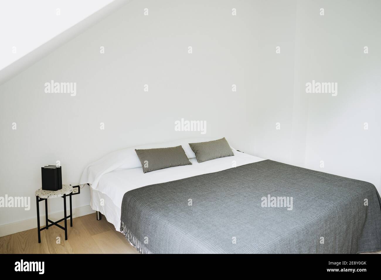 photo of a double bed in a hotel room Stock Photo