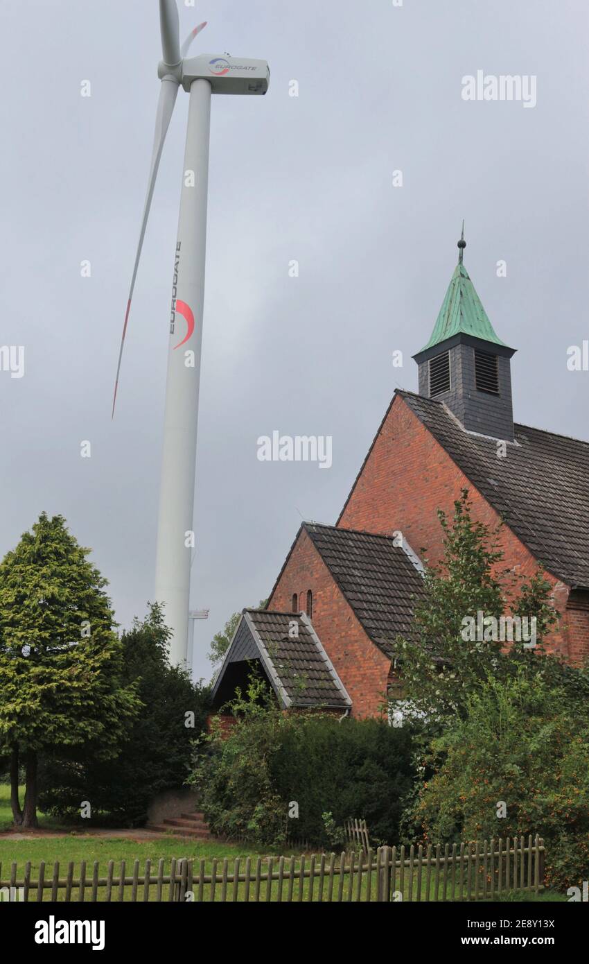 Bremerhaven, Germany Old church and modern wind turbine side by side