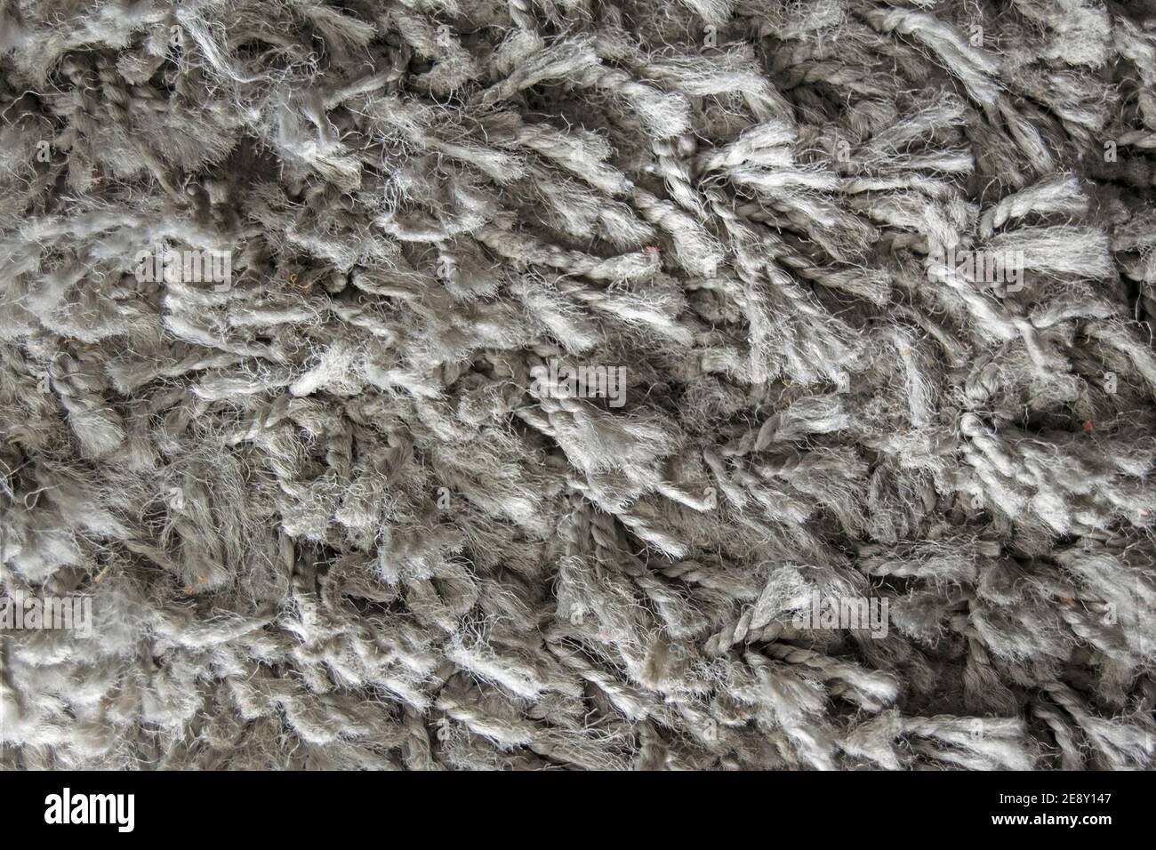 Texture of long hair carpet in grey, fur texture close up for designers Stock Photo