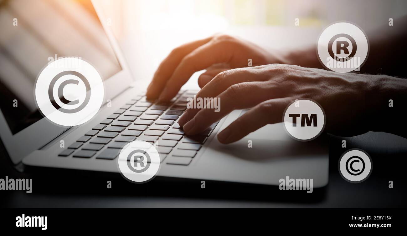 Concept of copyrighted material. Copyright, registered symbols with laptop composition Stock Photo