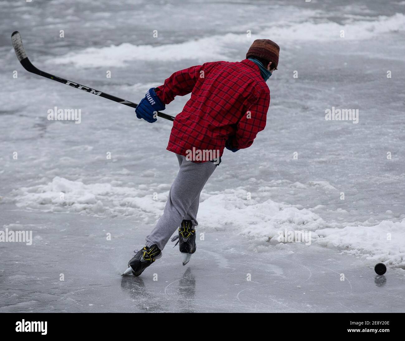 Ice hockey player on a frozen lake Stock Photo - Alamy