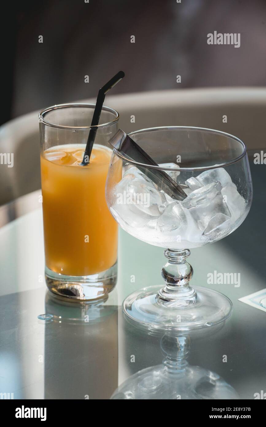 Fresh alcoholic cocktail. Vodka, melon liquor orange juice ice