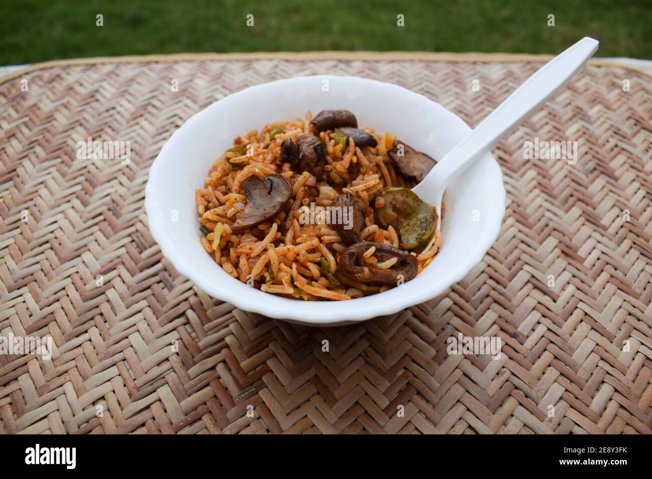 Delicious Mushroom fried rice with babycorns and other vegetables. Indian food cuisine like Mushroom biryani or pulav served in white bowl Stock Photo