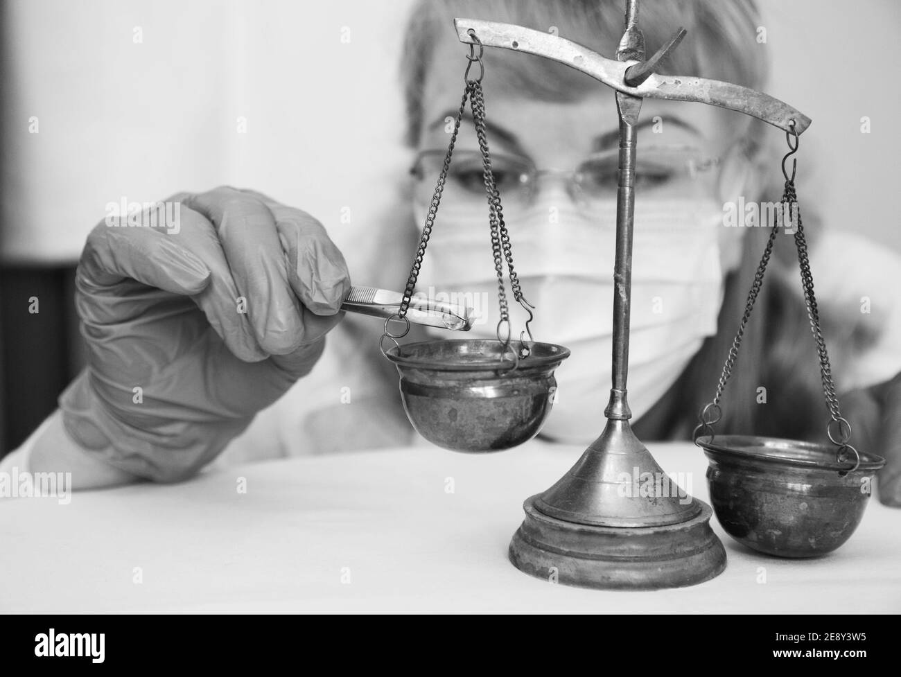 Laboranka measures food products on weights wb Stock Photo