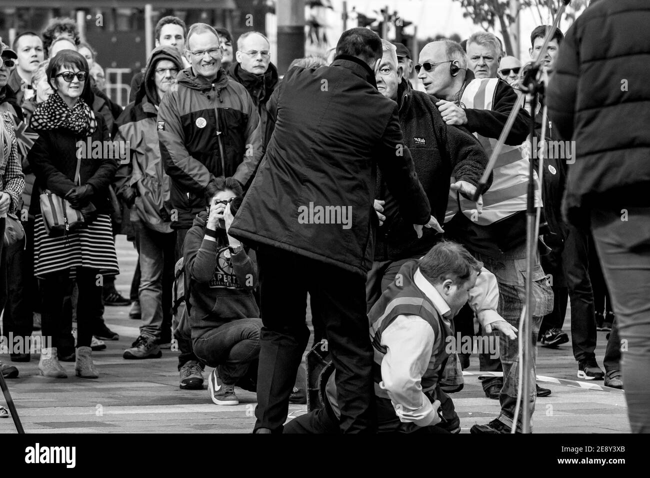Some people supporting Brexit interrupting aggressively the People's Vote rally on Keele Square. Documentary photographer, Jenny Goodfellow, seen documenting the skirmish in the thick of it. 6th October 2018, Sunderland, England. Stock Photo