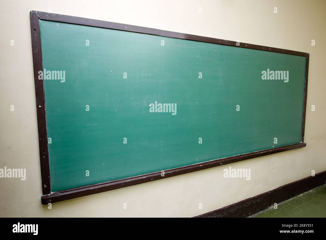 empty green blackboard in school classroom Stock Photo