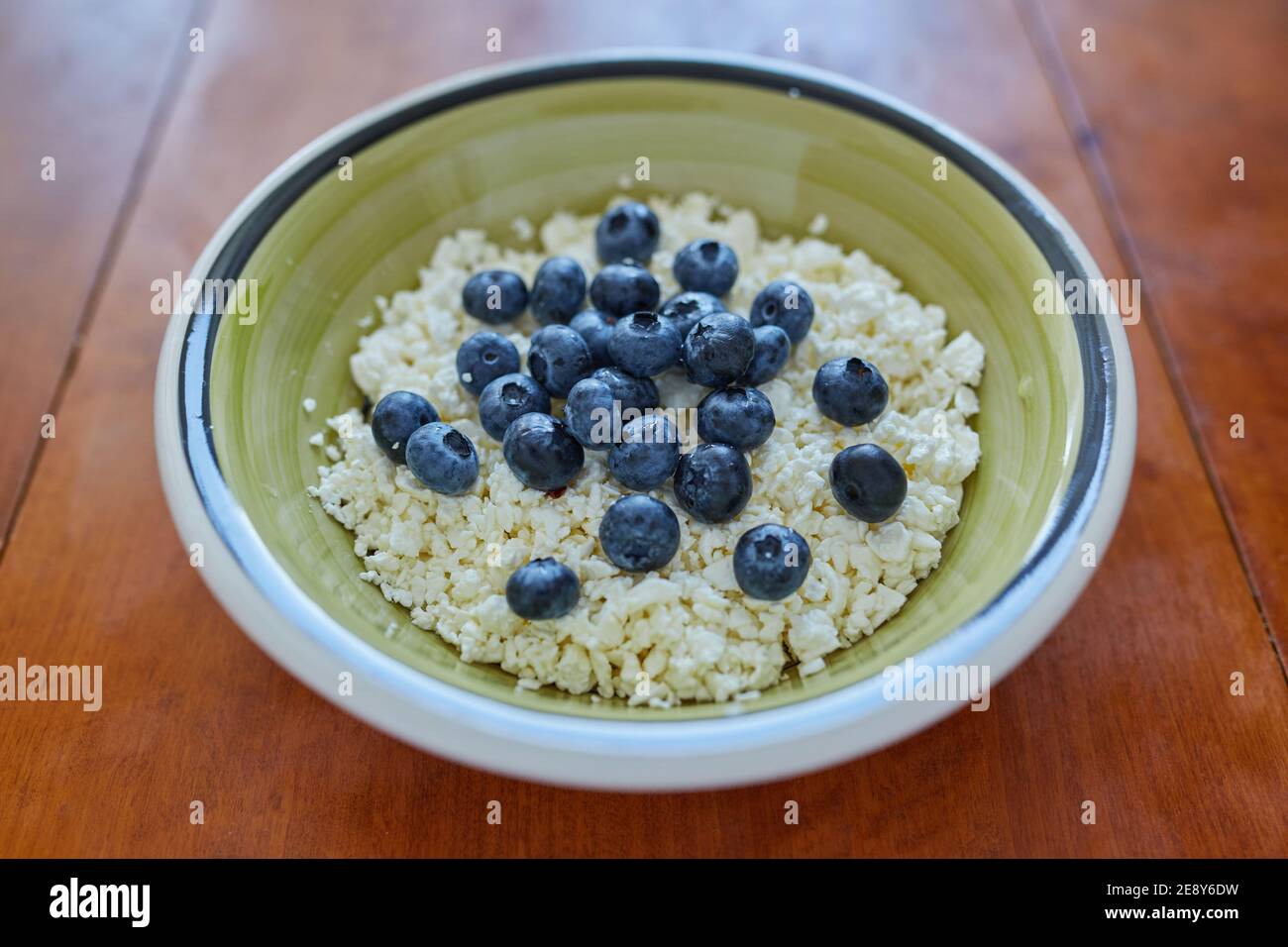 A bowl of cottage cheese with blueberries Stock Photo