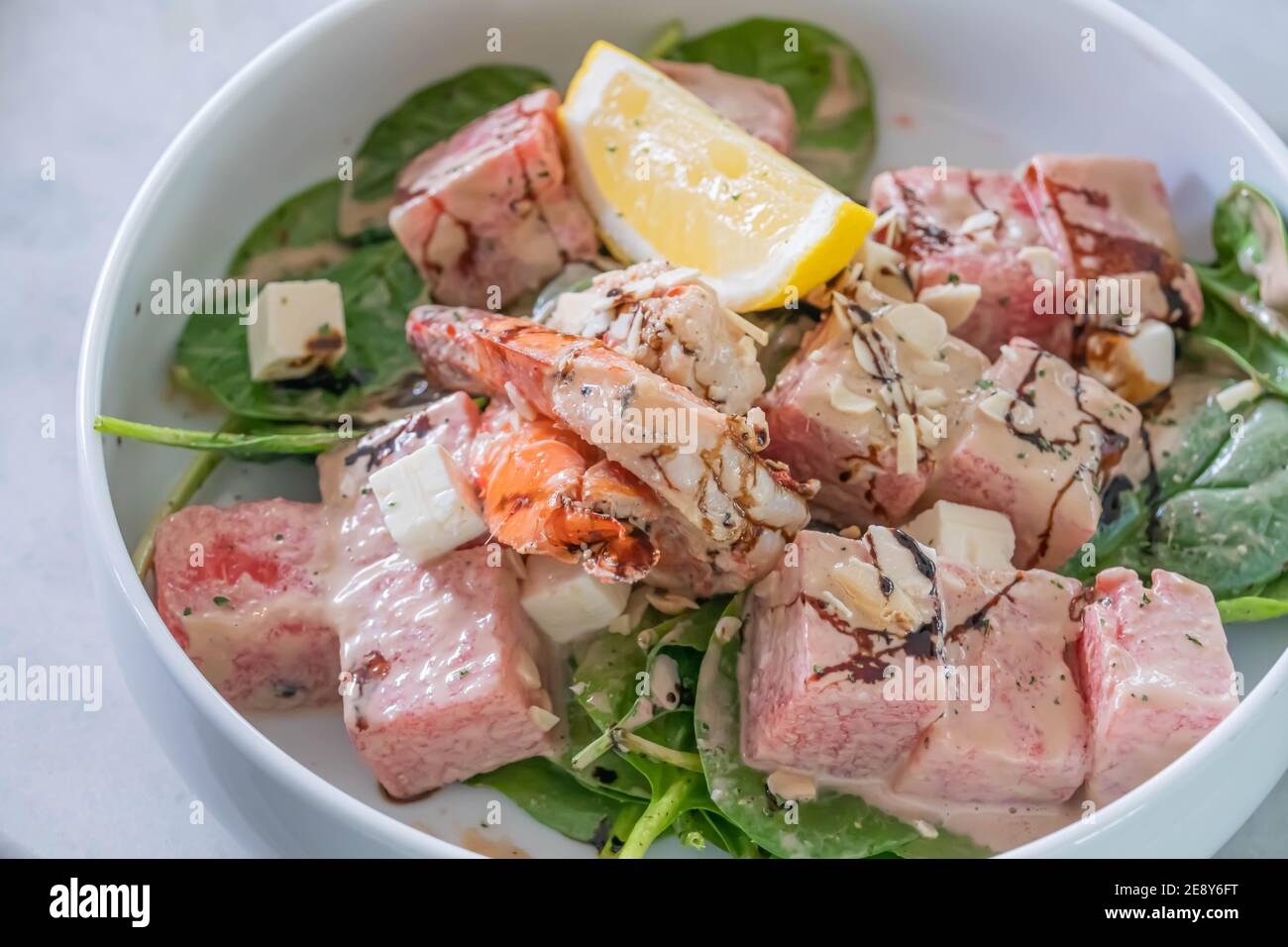 Dice beef, shrimp, lemon salad Stock Photo