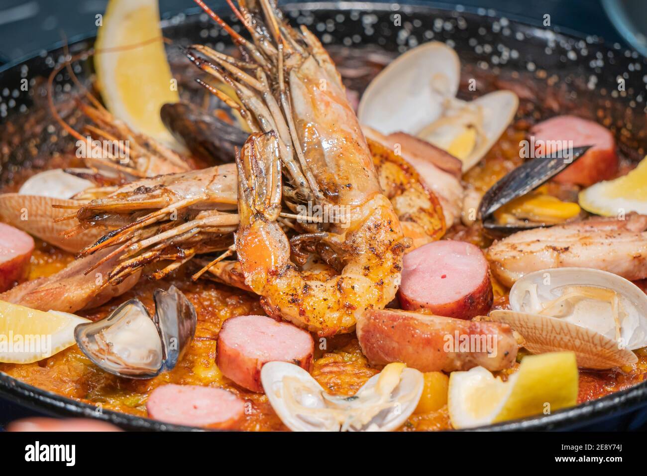 Delicious roated shrimps with lettuce and lemon Stock Photo