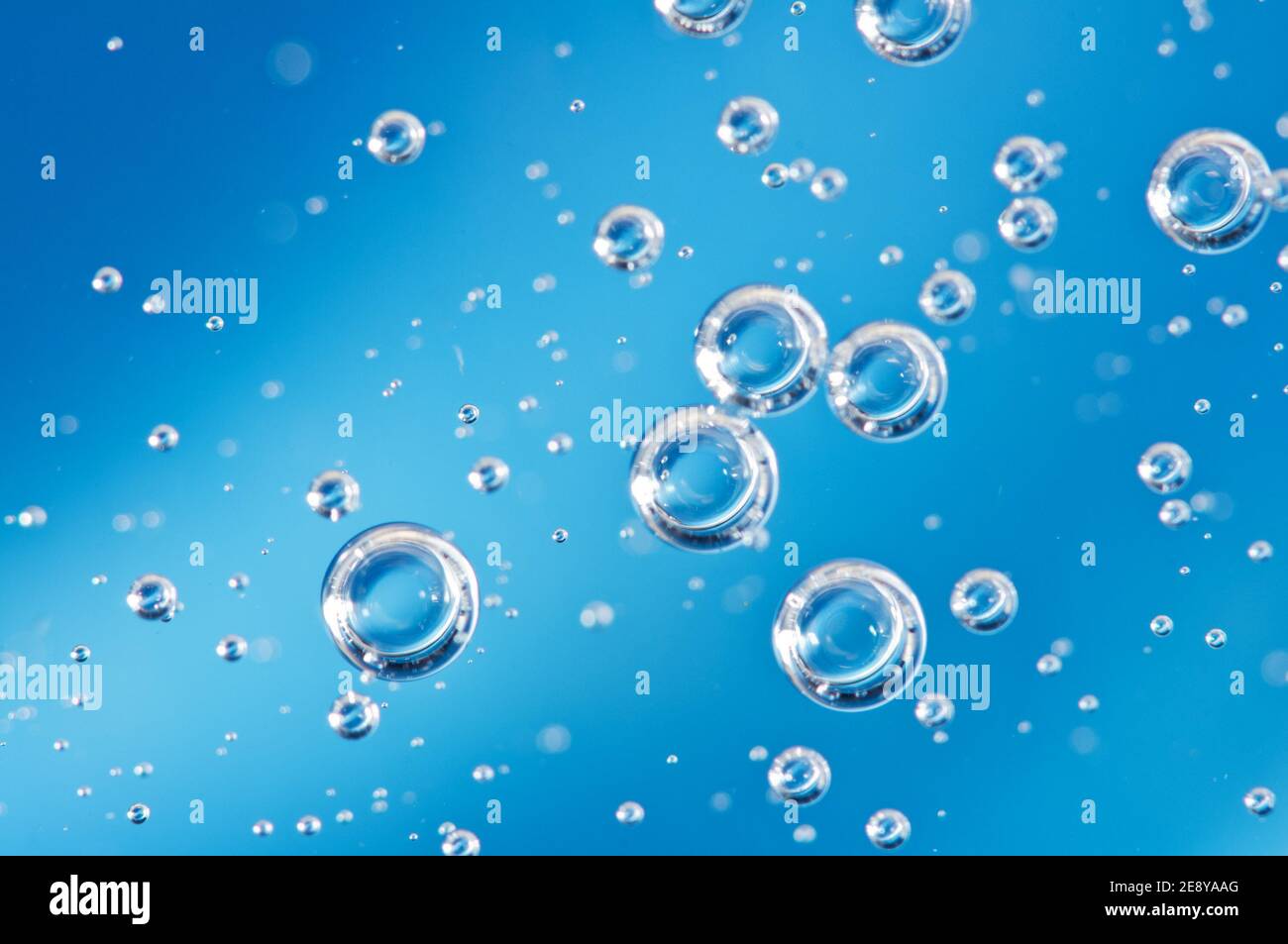 Oxygen in liquid. Bubbles . Background blue. Macro Stock Photo - Alamy