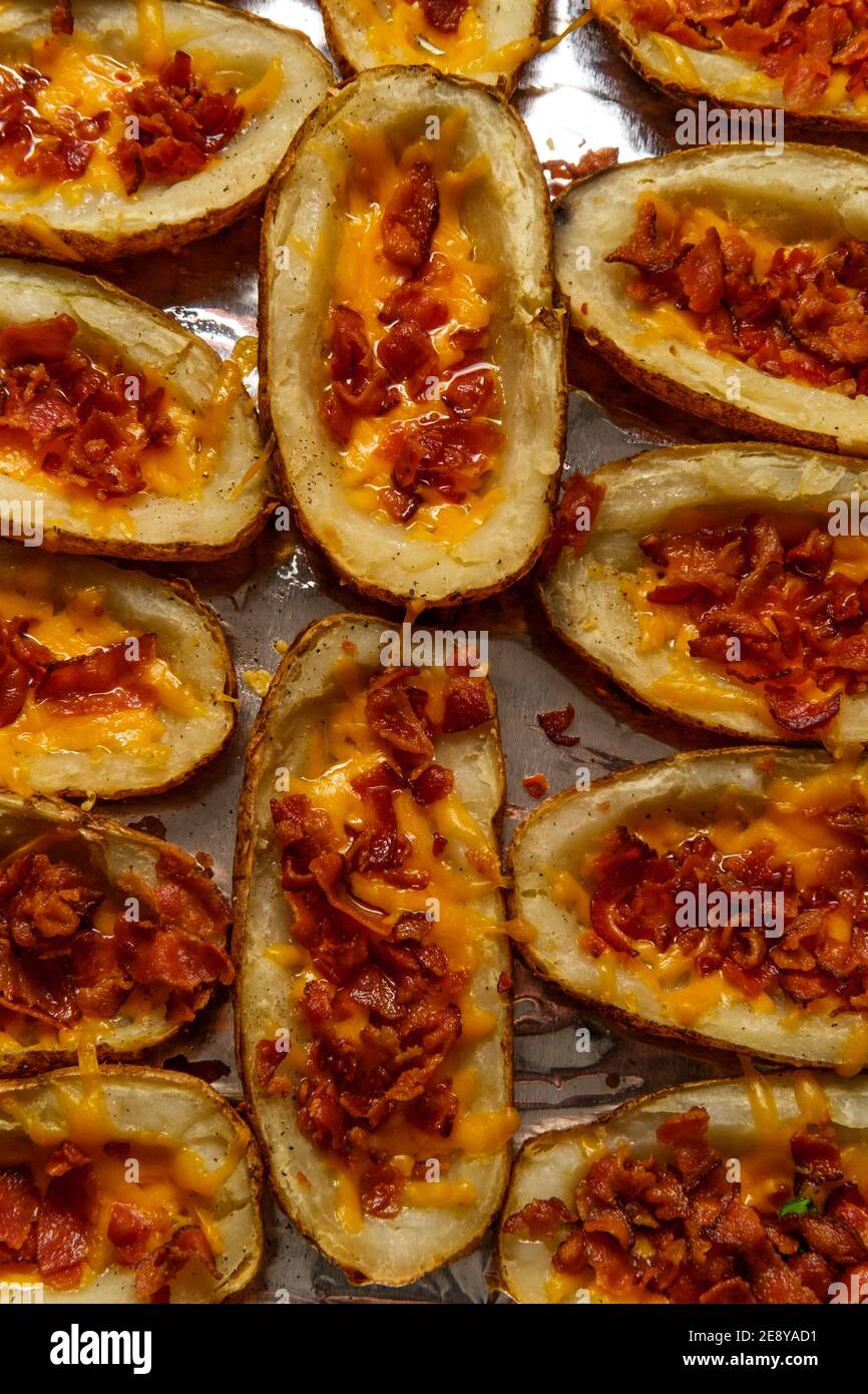 Stuffed baked potato skins with cheddar cheese and bacon crumbles Stock