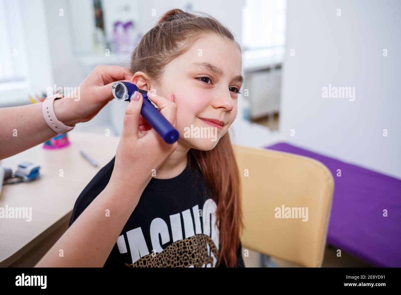 A Child At The Doctor s Appointment The Doctor Makes An Examination Of