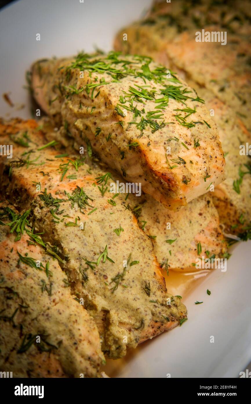 Dijon mustard grilled pink salmon on retail display at local market