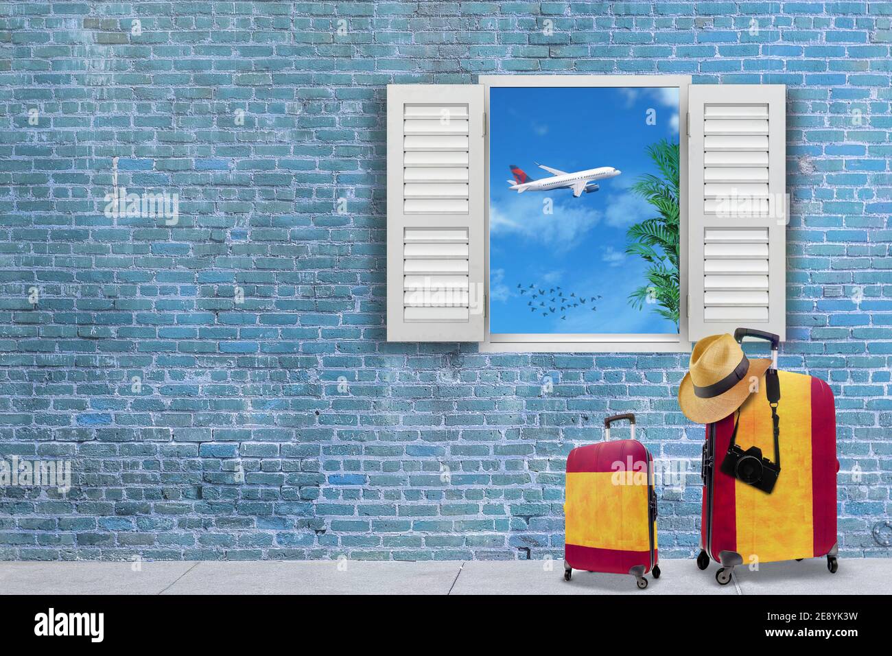 3D render of suitcases painted in Spanish flag colors and flying plane