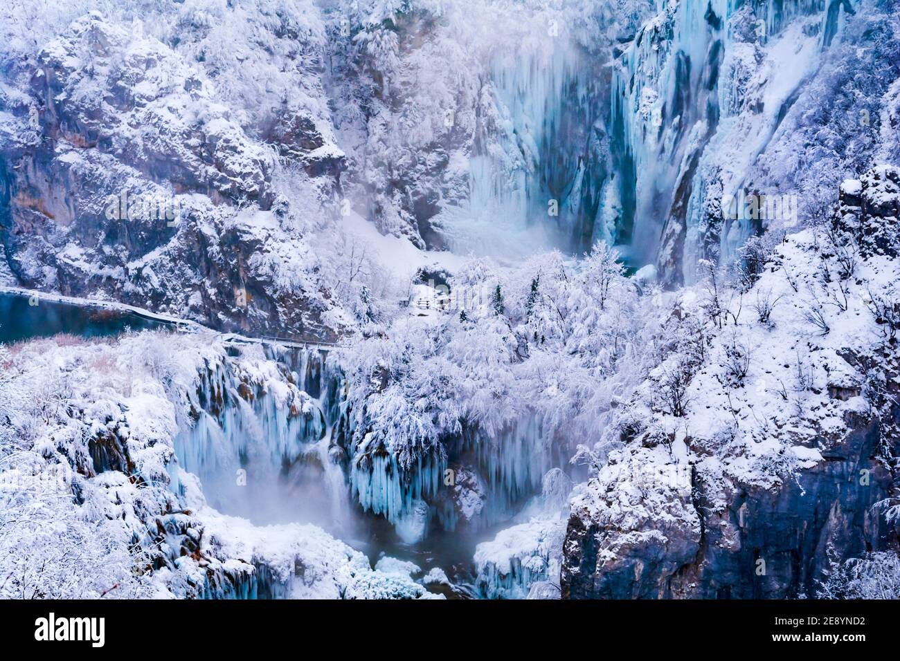 National park Plitvice lakes in Croatia Europe in Winter under covered cover snow and ice famous landmark place Veliki slap view from above Stock Photo