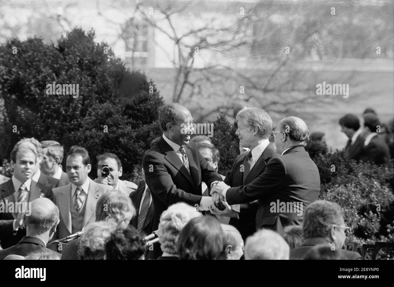 U.S. President Jimmy Carter shaking hands with Egyptian President Anwar Sadat and Israeli Prime Minister Menachem Begin at signing of Egyptian-Israeli Peace Treaty, White House, Washington, D.C., USA, Warren K. Leffler, March 26, 1979 Stock Photo