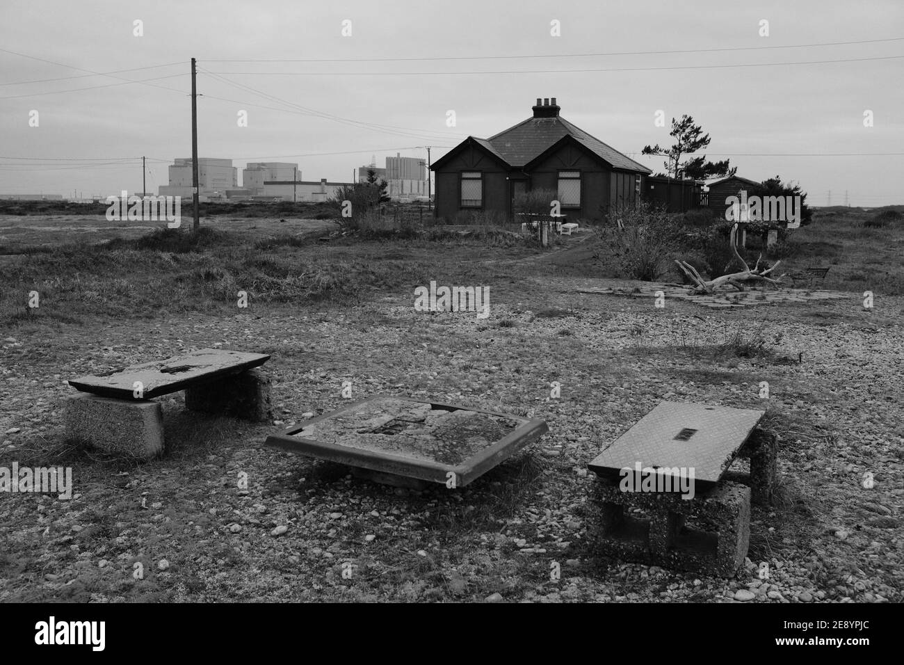 Homes on the shoreline at Dungeness beach in Kent, England Stock Photo