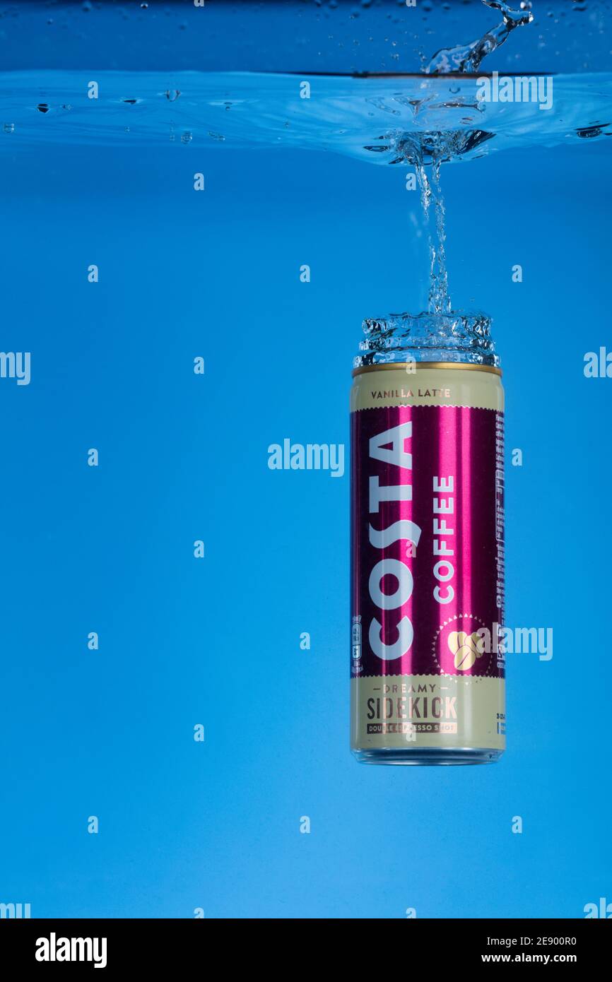 Freeze motion photo of a can of Costa Coffee dropped into water. Stock Photo