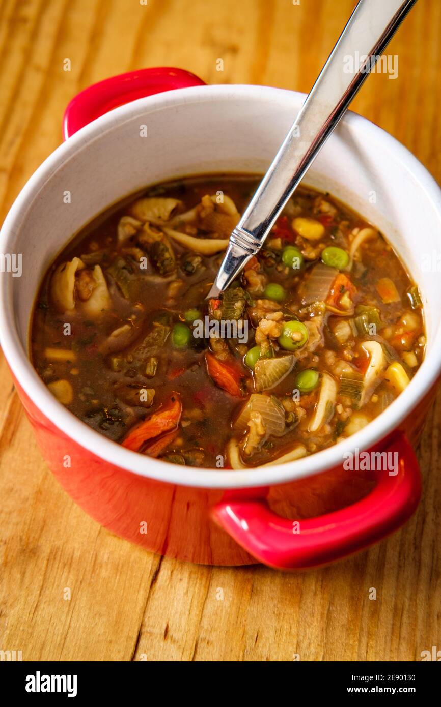 Italian vegetable soup in crock bowl with handles Stock Photo - Alamy