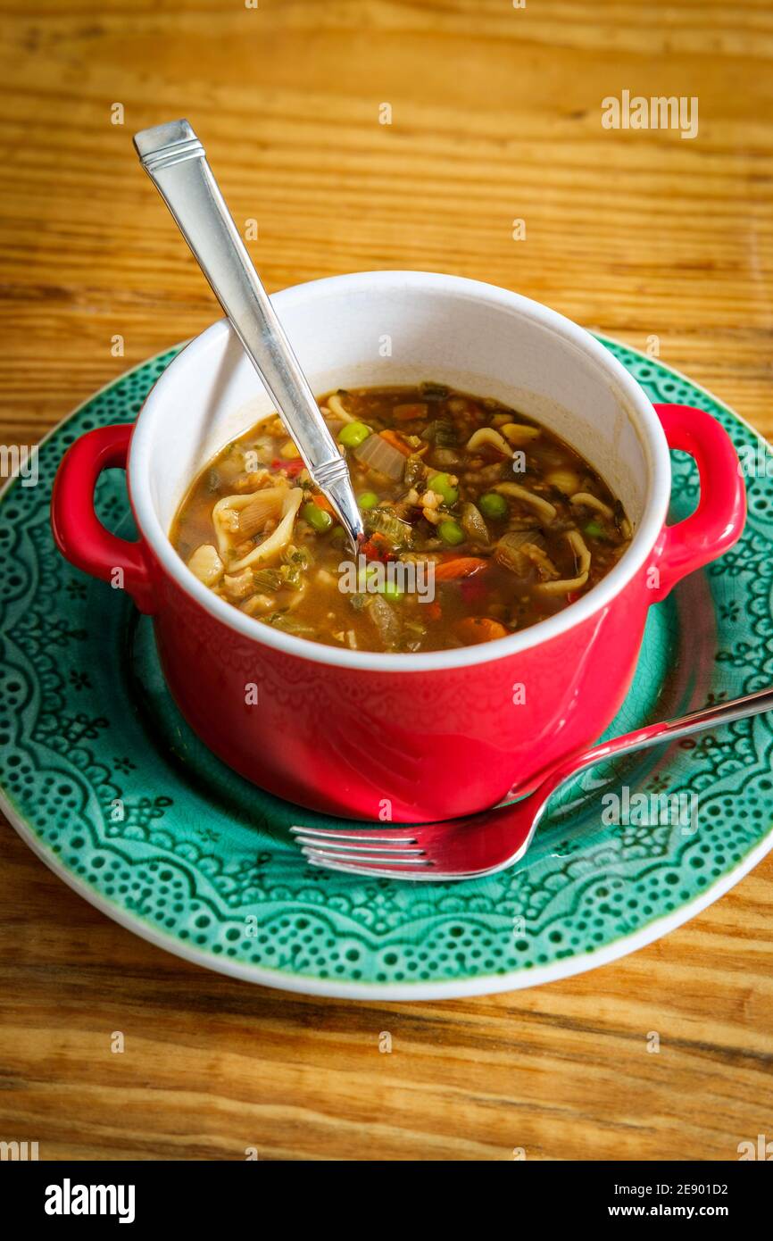 Italian vegetable soup in crock bowl with handles Stock Photo - Alamy