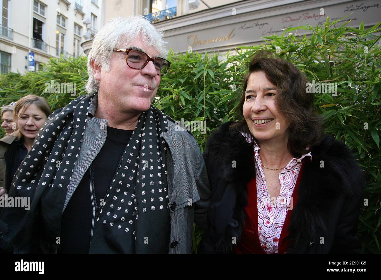 Author Gilles Leroy, seen here with his publisher Isabelle Gallimard,  speaks to the press after being awarded with the 2007 prestigious  literature prize Prix Goncourt for his book Alabama Song in Paris,