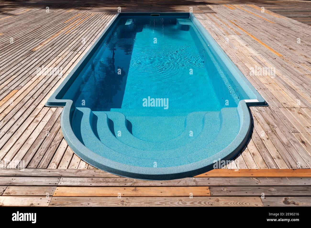 New modern fiberglass plastic swimming pool entrance step with clean fresh  refreshing blue water on bright hot summer day at yard or resort hotel spa  Stock Photo - Alamy