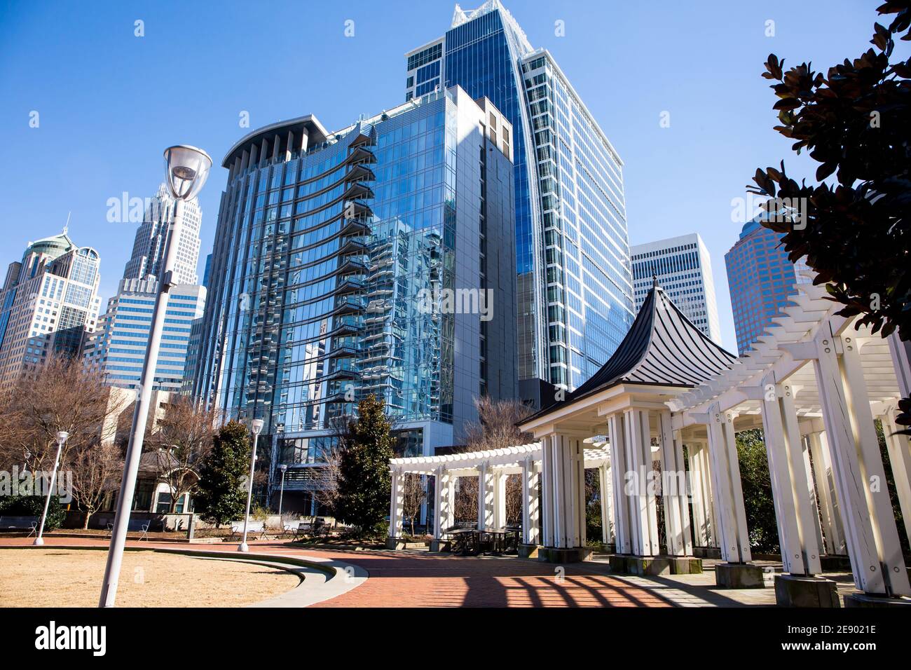 A view of the Charlotte, North Carolina, skyline in a bright blue sky as seen from Romare Bearden Park. Stock Photo