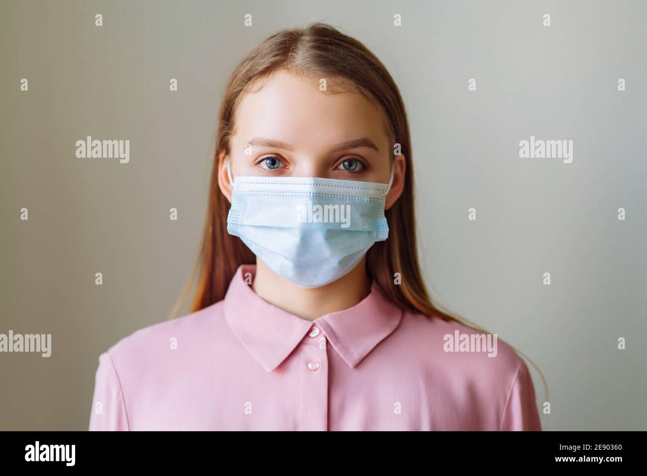Woman wearing mask for protection from disease. Appeal to stay home. Coronavirus concept. Stock Photo