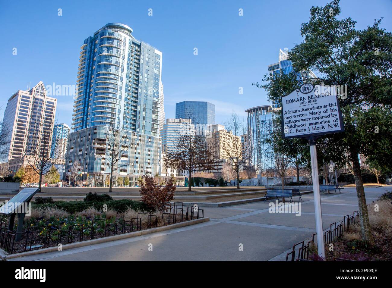 A view of the Charlotte, North Carolina, skyline in a bright blue sky as seen from Romare Bearden Park. Stock Photo