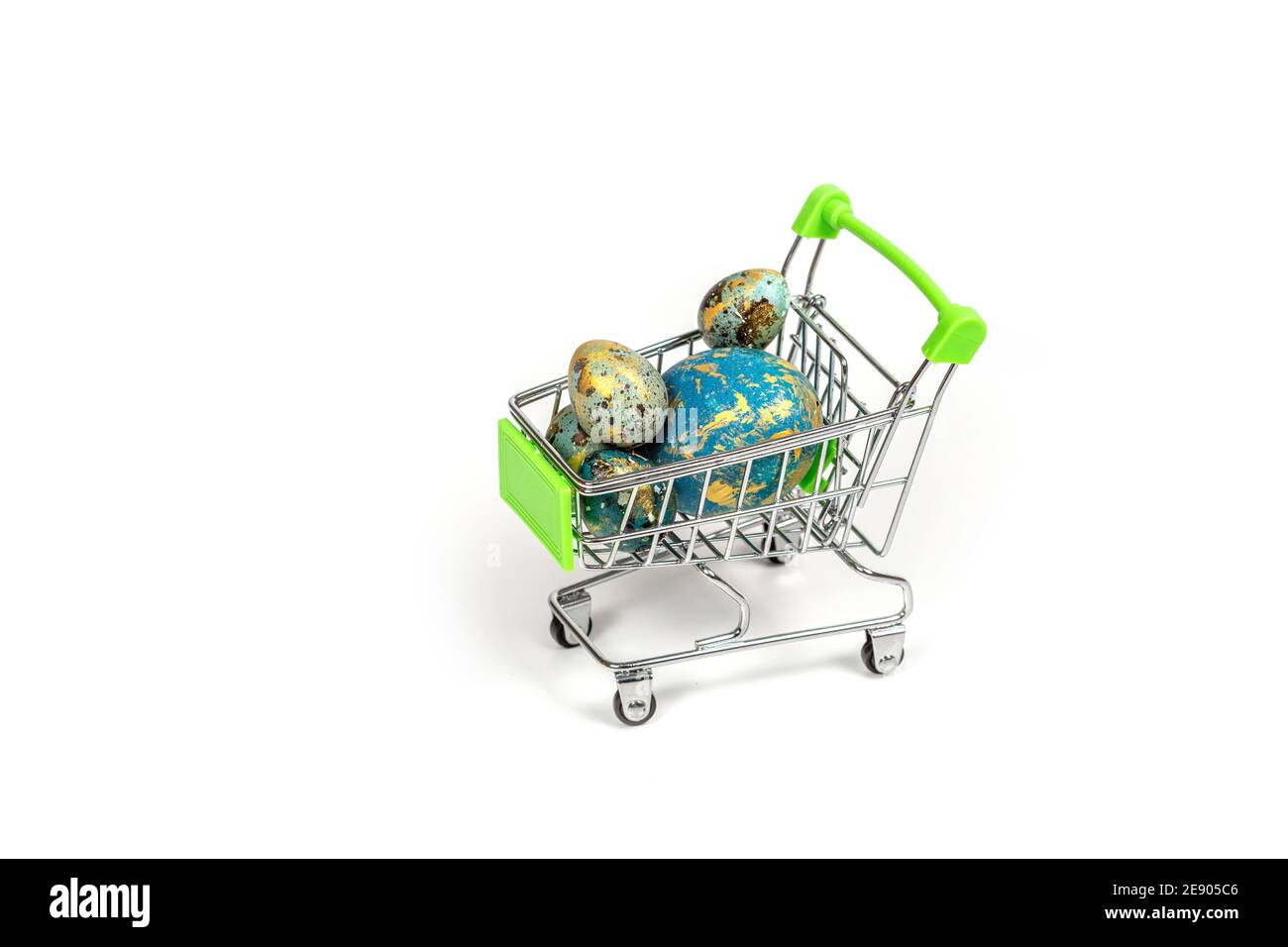 .Basket with colored Easter eggs isolated on a white background Stock Photo