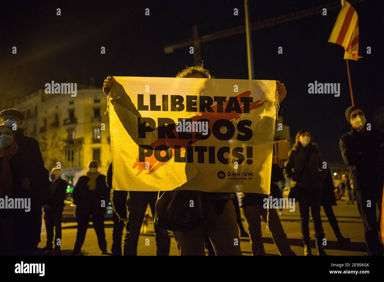 Barcelona, Catalonia, Spain. 1st Feb, 2021. Protester is seen with the flag that says, freedom political prisoners.Catalan pro-independence groups have made demonstrations at various points throughout Catalonia in support of political prisoners convicted of crimes of sedition by the Supreme Court of Spain, after the Provincial Electoral Board of Barcelona decided on January 28 that it did not authorize the concentrations Weekly Mondays held in support of political prisoners between February 1 and 8, which coincide with the electoral campaign of the Generalitat of Catalonia. (Credit Image: © Stock Photo