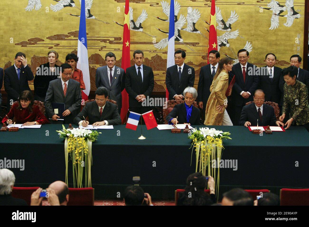 Areva CEO Anne Lauvergeon (L) and French Minister for the Economy, Finance and Employment Christine Lagarde (R) attend a signing ceremony with Chinese President Hu Jintao (2nd row R) and his French counterpart Nicolas Sarkozy (2nd row C) and members of the French government at the 'Great Hall of People' during a 3-Day state visit in Beijing, China, on November 26, 2007. Sarkozy has overseen the signing of about 30 billion dollars in aviation, nuclear and other deals in what he described as an unprecedented day of trade with China. Photo by Patrick Durand/ABACAPRESS.COM Stock Photo