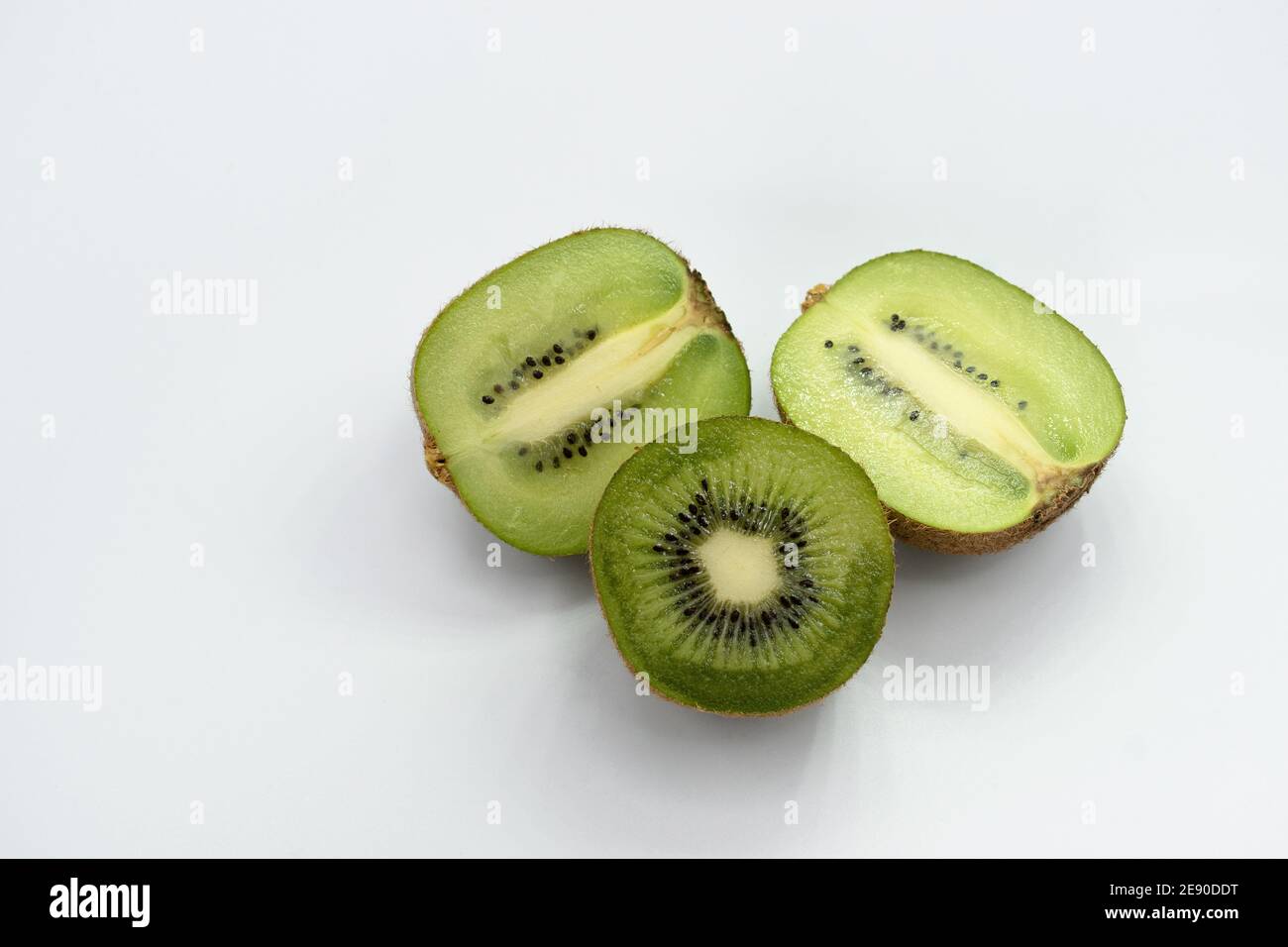 Half of ripe green kiwi isolated on white background. with