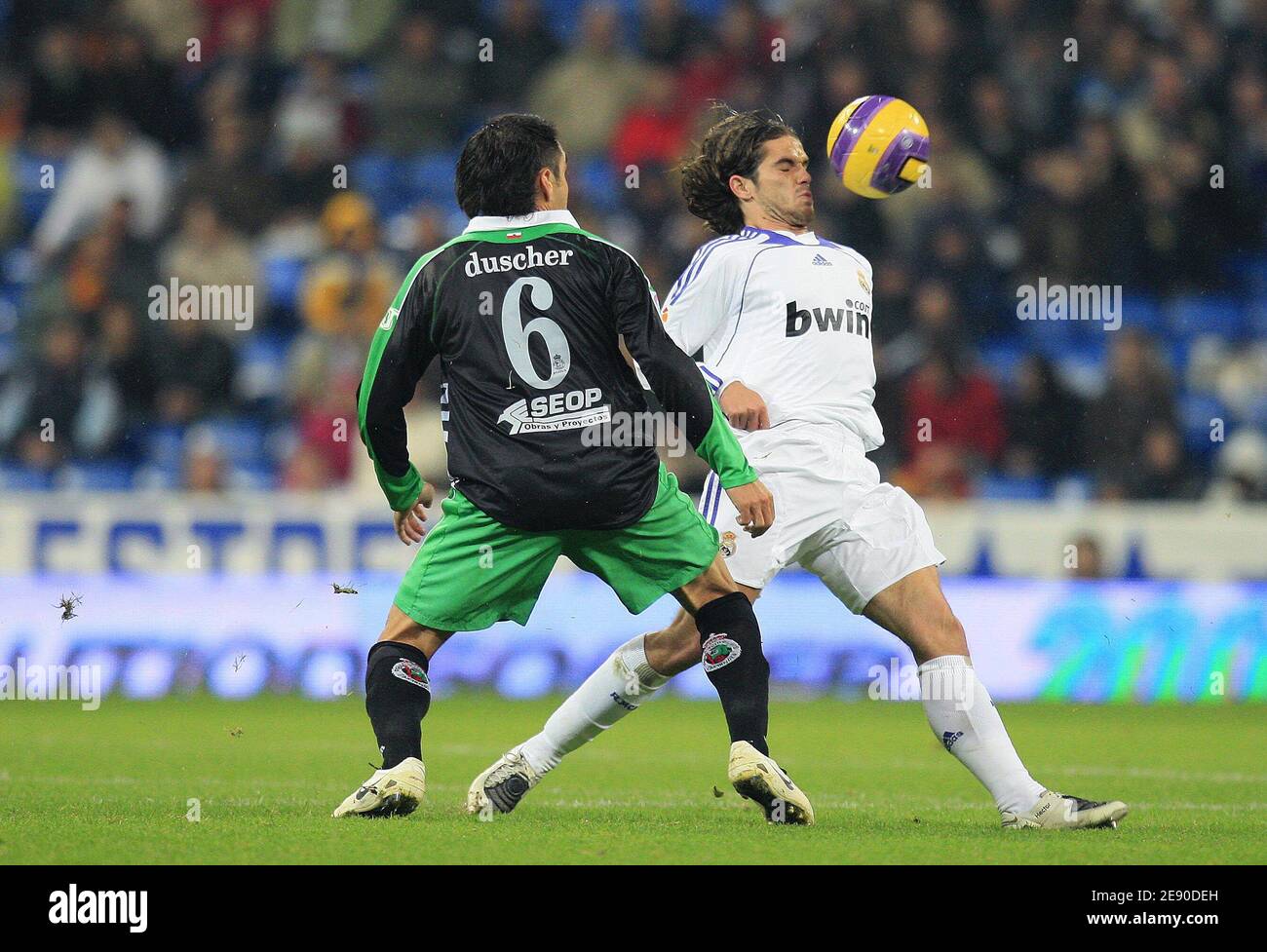 Real Madrid's Fernando Gago heads the ball during the Spanish League soccer match between Real Madrid and Racing Santander at the Santiago Bernabeu Stadium in Madrid, Spain on December 1, 2007. Real won 3-1. Photo by Christian Liewig/ABACAPRESS.COM Stock Photo