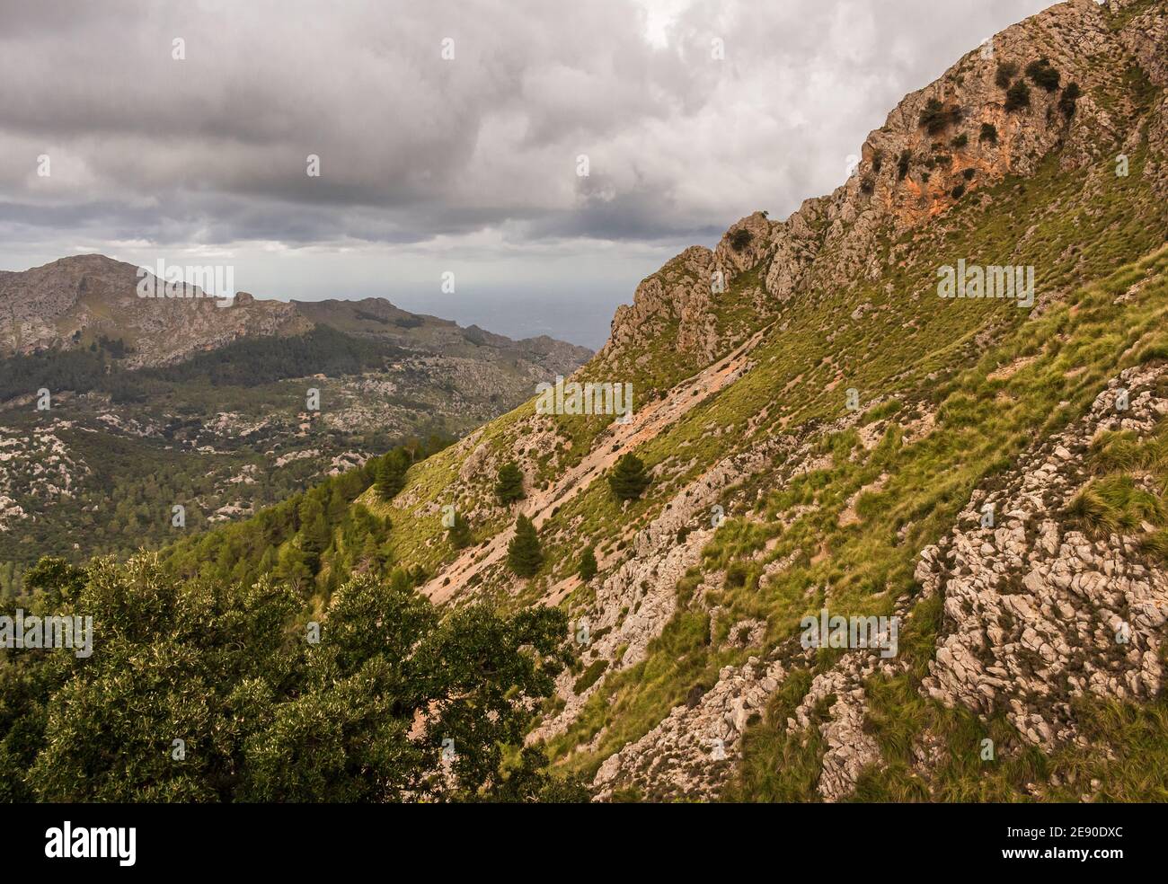 Mountain landscape below cloudy sky. Escorca. Serra de Tramuntana. Mallorca Island. Spain. Stock Photo