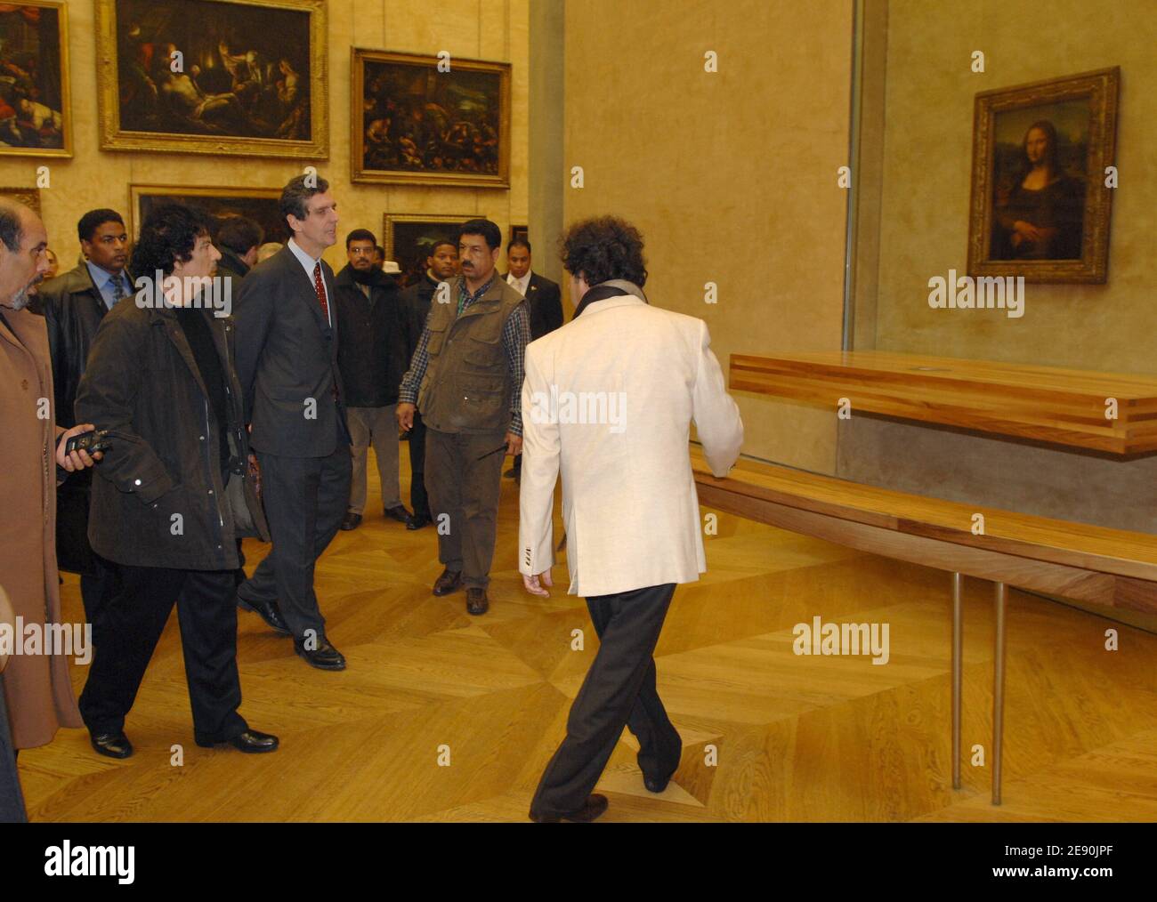 Libyan leader Moammar Gadhafi and his cousin Kadhaf Al-Dam look at the Leonardo da Vinci's Mona Lisa paint as he visits the Louvre museum during his controversial six-day visit in Paris, France on December 13, 2007. Photo by Chesnot-Stevens/Pool/ABACAPRESS.COM Stock Photo